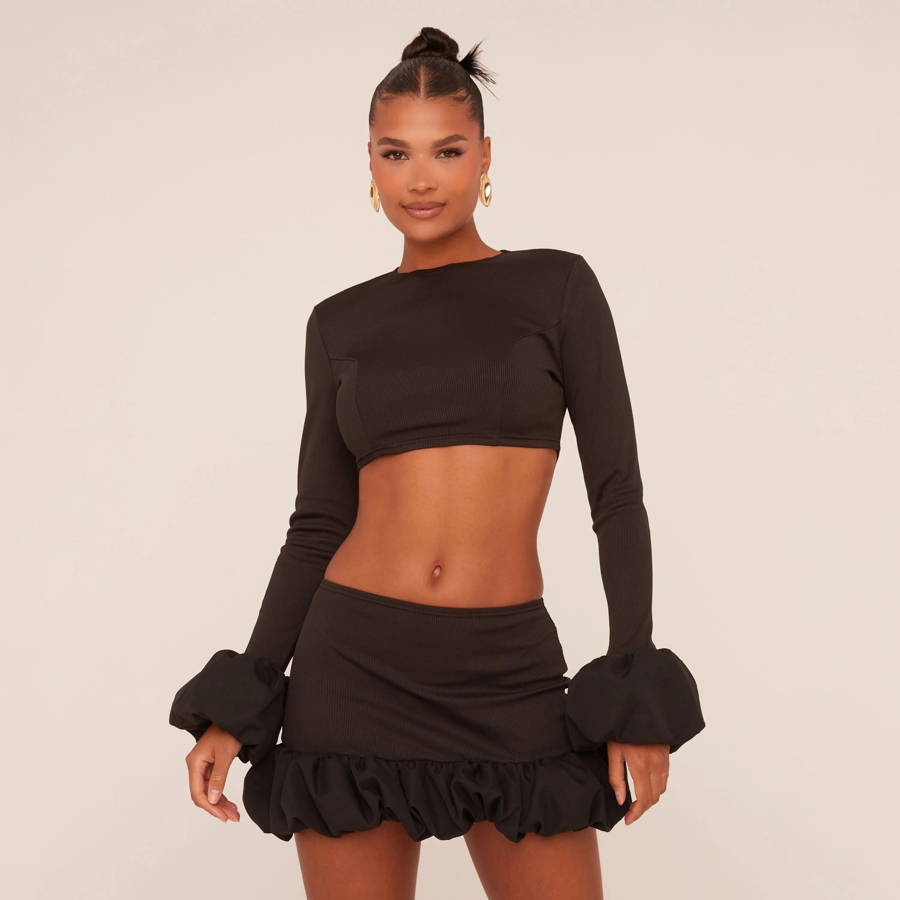 Mid Rise Puffball Mini Skirt In Black Rib